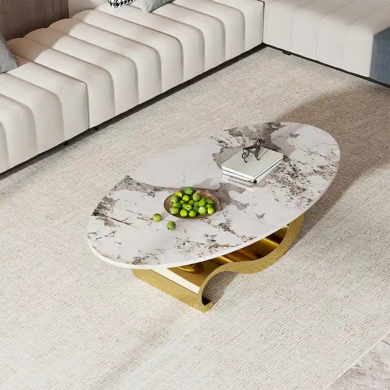Table basse ovale Gold & Stone avec plateau en pierre frittée et base en acier inoxydable doré - Usage unique