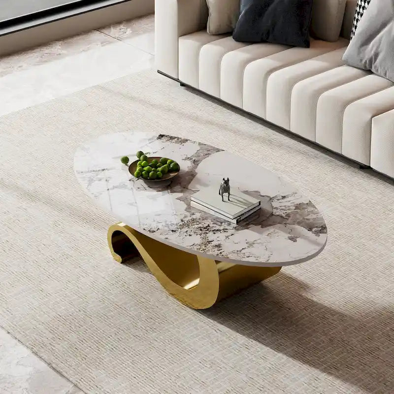 Table basse ovale Gold & Stone avec plateau en pierre frittée et base en acier inoxydable doré - Usage unique