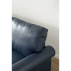 Causeuse en similicuir bleu marine avec clous décoratifs argentés et rangement sous l'assise - 2 places