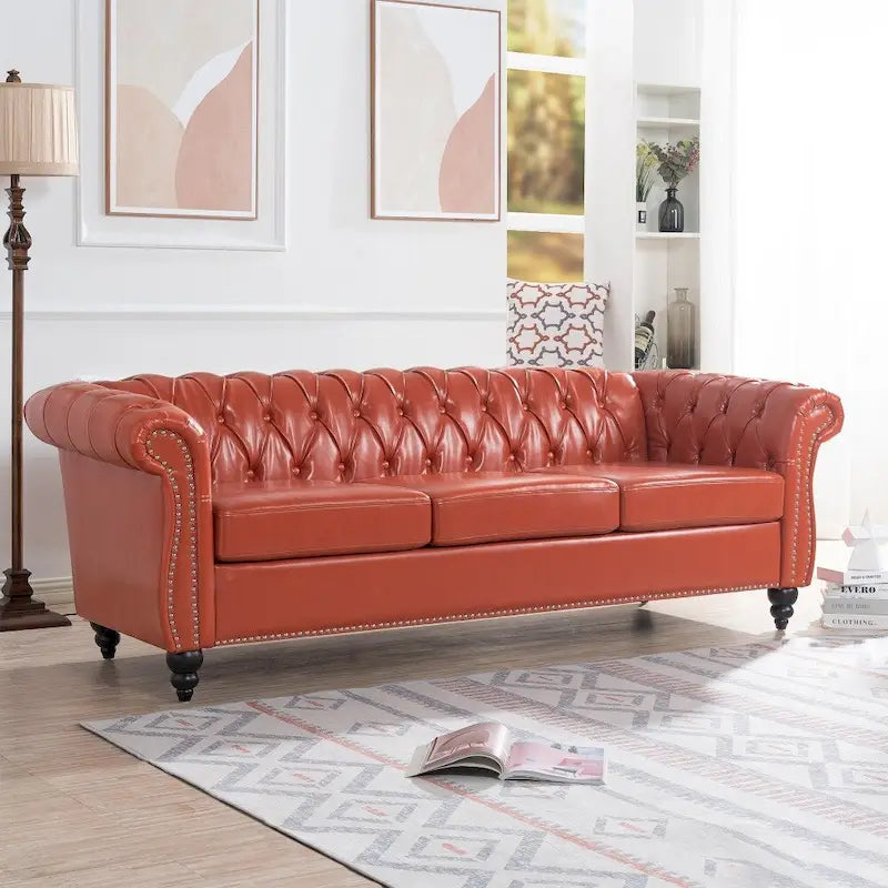 Canapé Chesterfield 3 places en similicuir noir/marron/blanc/orange avec accoudoirs roulés, capitonnage et clous décoratifs