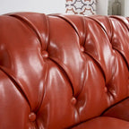 Canapé Chesterfield 3 places en similicuir noir/marron/blanc/orange avec accoudoirs roulés, capitonnage et clous décoratifs