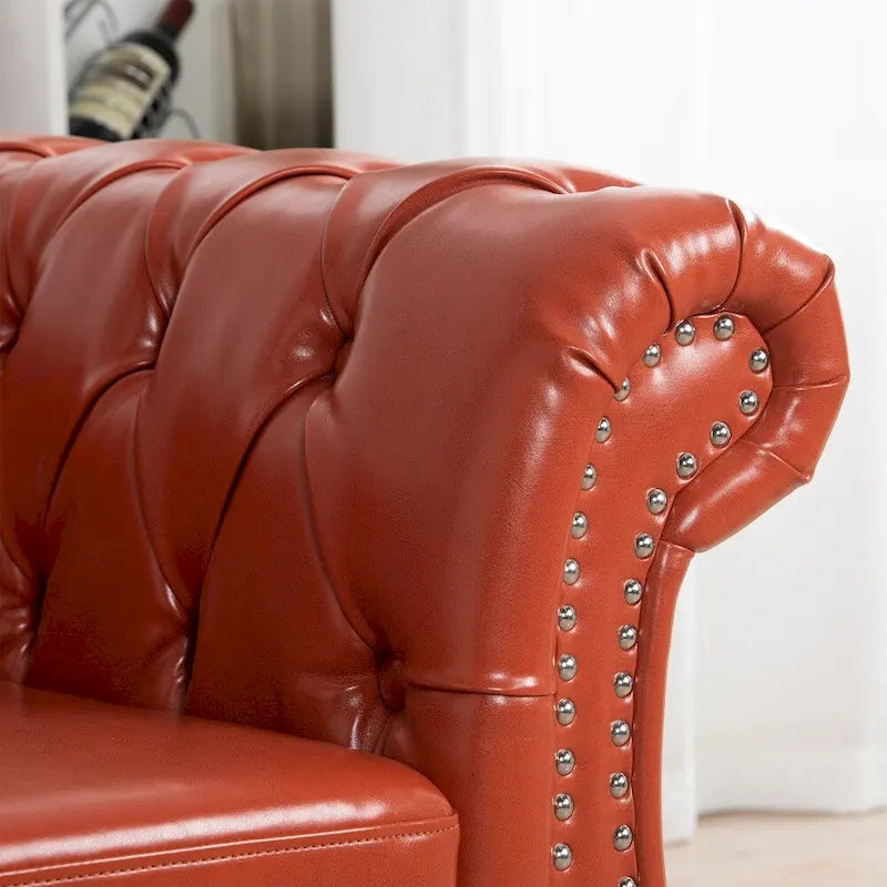 Canapé Chesterfield 3 places en similicuir noir/marron/blanc/orange avec accoudoirs roulés, capitonnage et clous décoratifs