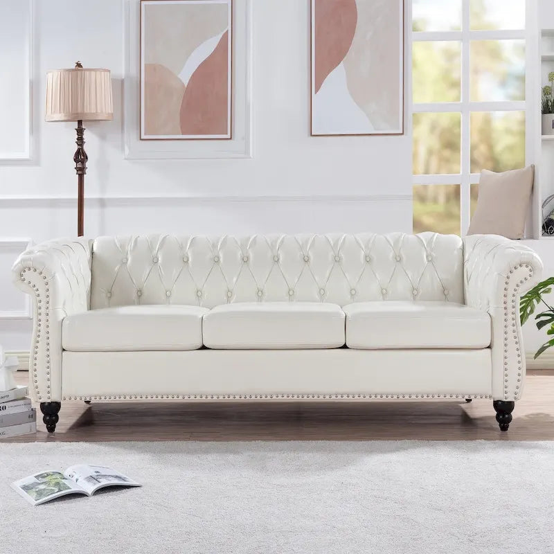 Canapé Chesterfield 3 places en similicuir noir/marron/blanc/orange avec accoudoirs roulés, capitonnage et clous décoratifs