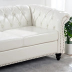 Canapé Chesterfield 3 places en similicuir noir/marron/blanc/orange avec accoudoirs roulés, capitonnage et clous décoratifs