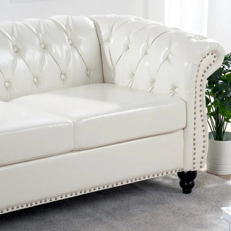 Canapé Chesterfield 3 places en similicuir noir/marron/blanc/orange avec accoudoirs roulés, capitonnage et clous décoratifs