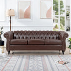 Canapé Chesterfield 3 places en similicuir noir/marron/blanc/orange avec accoudoirs roulés, capitonnage et clous décoratifs