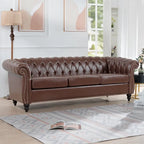 Canapé Chesterfield 3 places en similicuir noir/marron/blanc/orange avec accoudoirs roulés, capitonnage et clous décoratifs