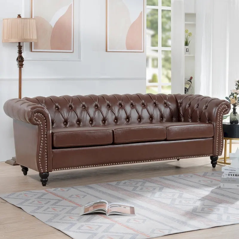 Canapé Chesterfield 3 places en similicuir noir/marron/blanc/orange avec accoudoirs roulés, capitonnage et clous décoratifs