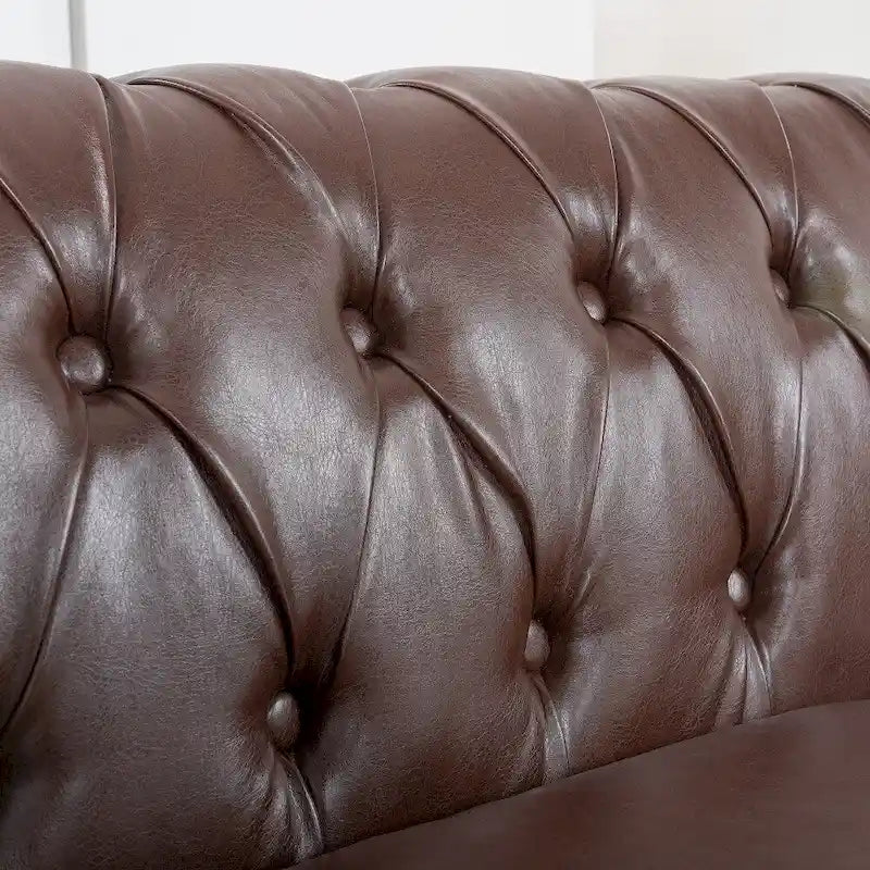 Canapé Chesterfield 3 places en similicuir noir/marron/blanc/orange avec accoudoirs roulés, capitonnage et clous décoratifs